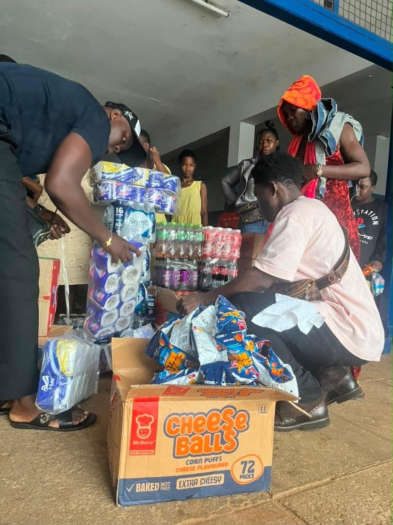 Volunteers sorting boxes of donated snacks and drinks